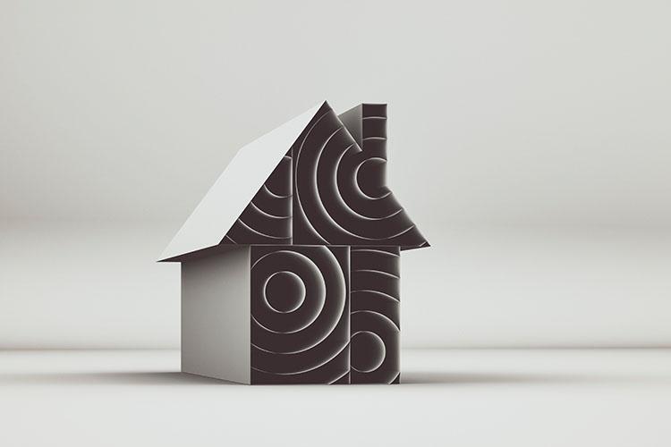 Minimalistische Hausform aus geometrischen Blöcken mit kreisförmigen Mustern in Schwarz-Weiß.