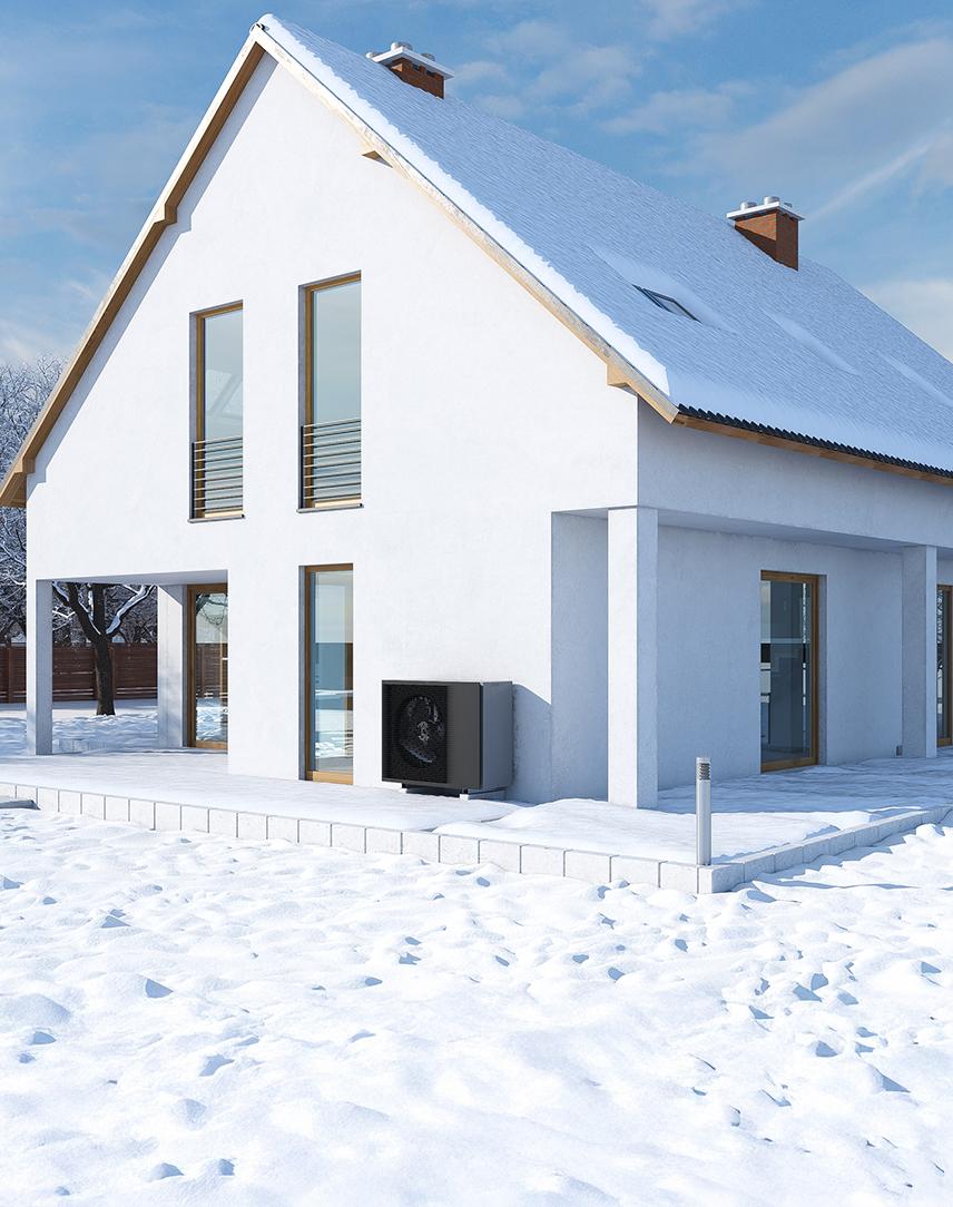 Haus mit Wärmepumpe in Schneelandschaft